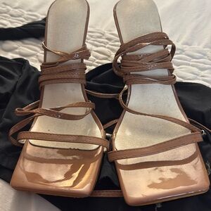 Tan heels. Long straps for cross around leg